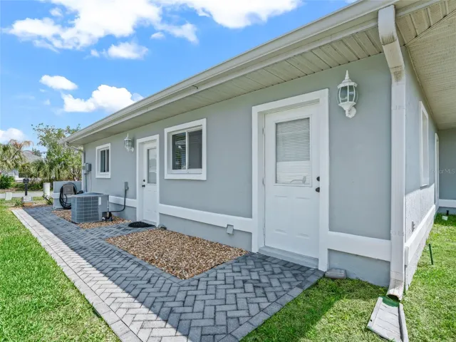 Paver walkway w/access to garage & additional storage rm