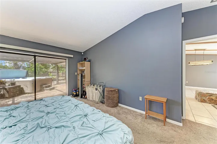 Primary Bedroom with sliders to back lanai