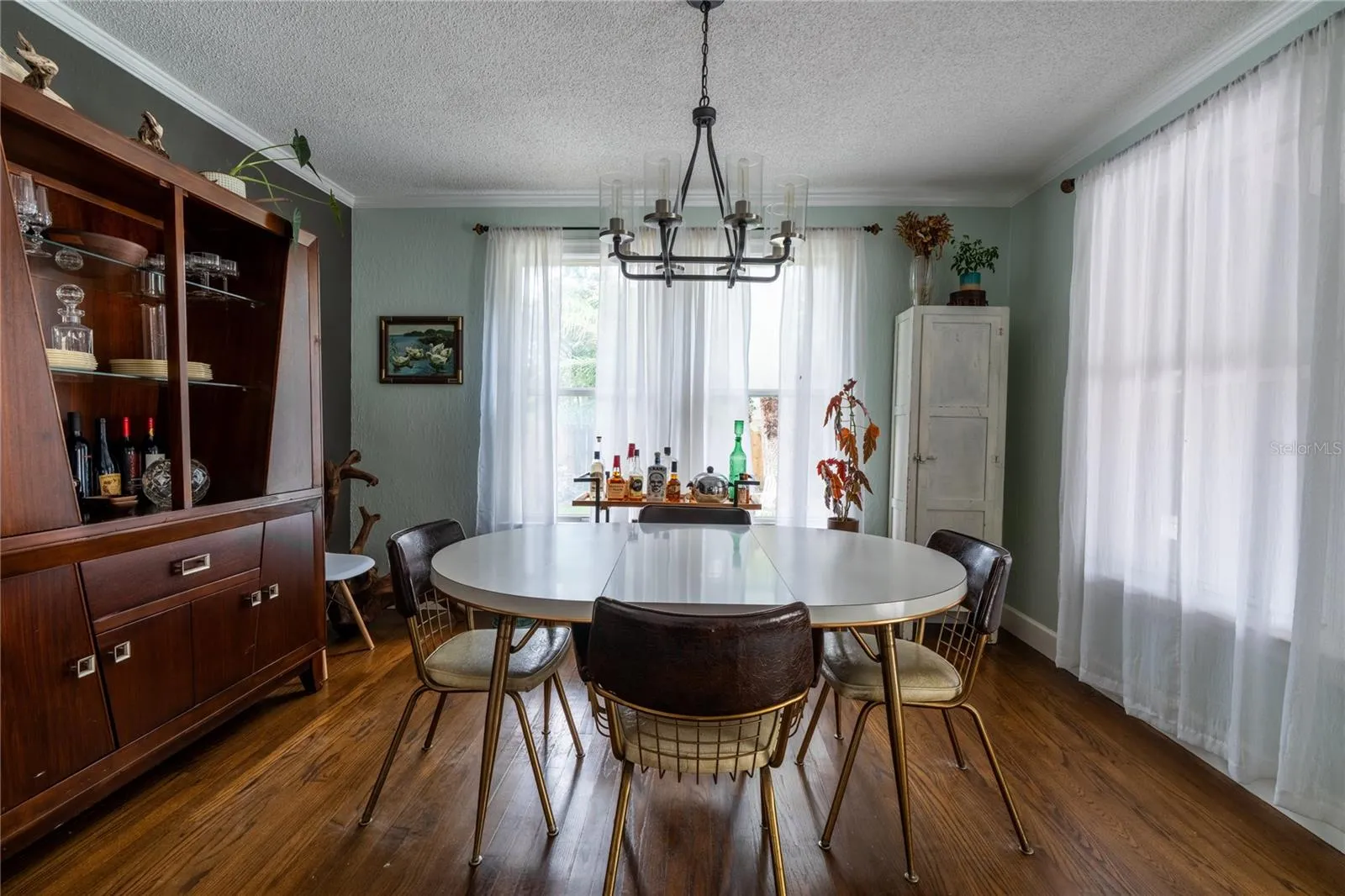 Dining area directly off kitchen and outdoor access to resort style pool!