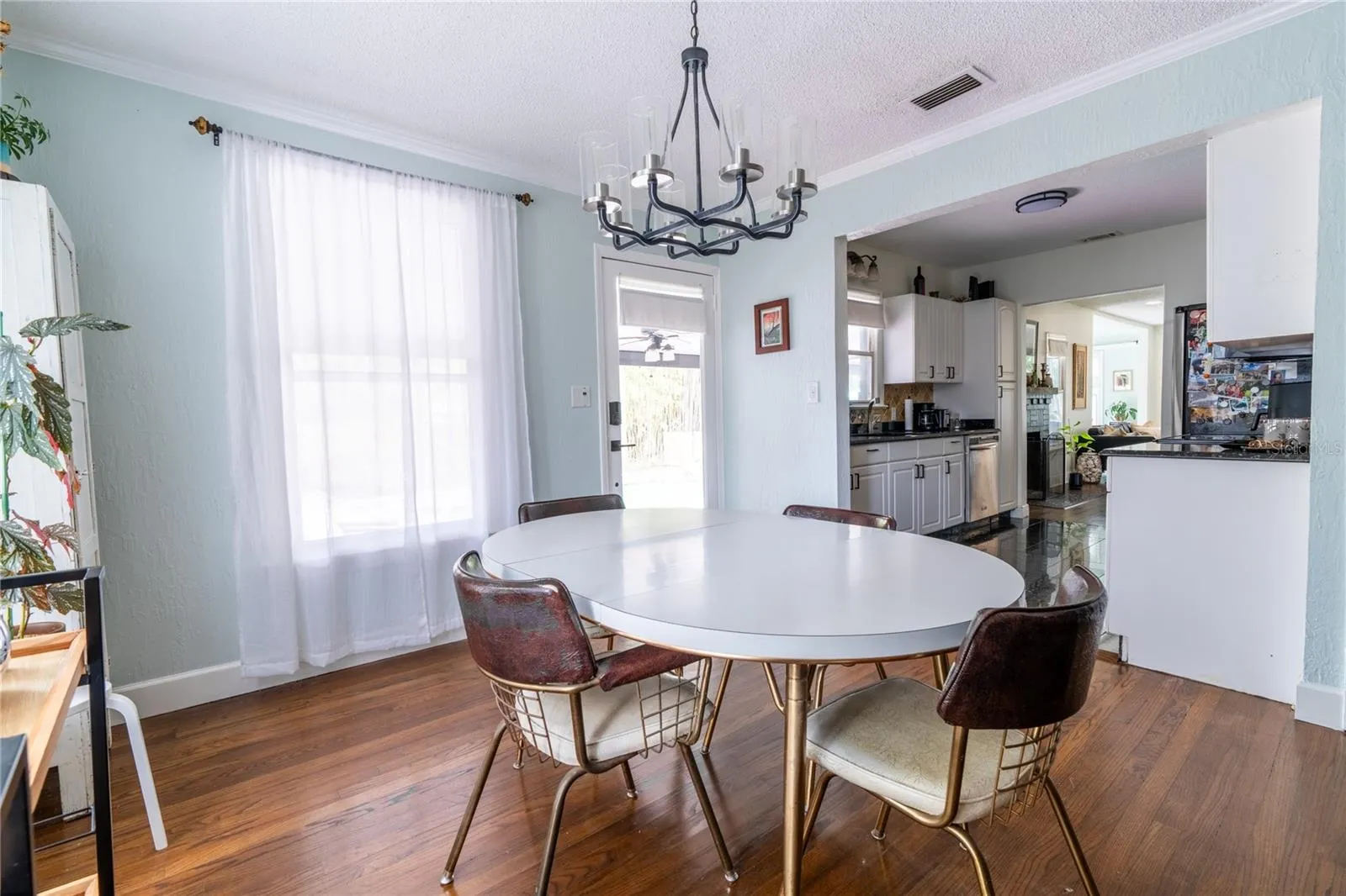 Dining area directly off kitchen and outdoor access to resort style pool!