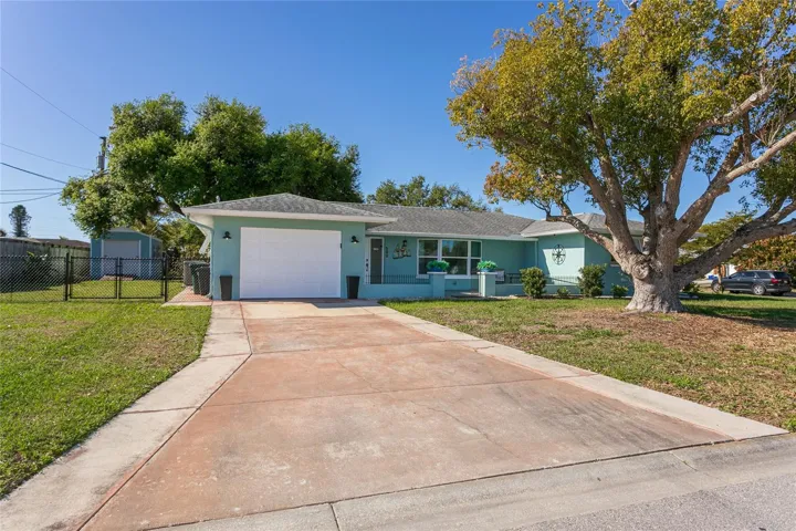 Front of house with large side yard for RV or boat
