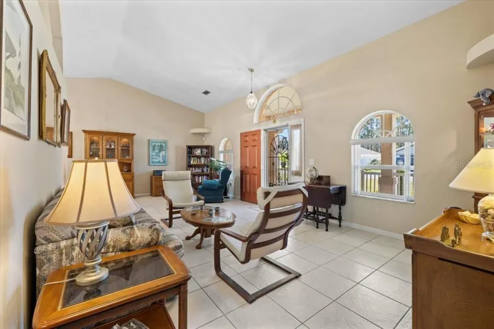 Spacious living room with soaring ceilings and custom built-ins,