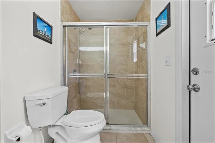 Guest bath with convenient access to the pool area, ideal for indoor-outdoor living