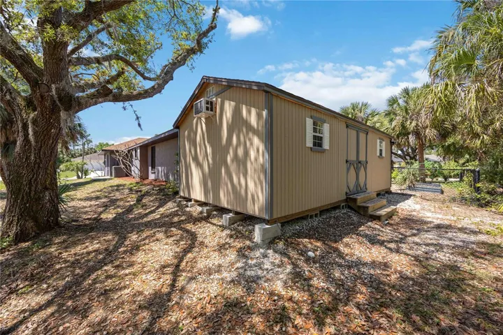 She shed with A/C unit, electric and insulation