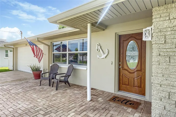 Front paved patio area perfect for enjoying sunset views.