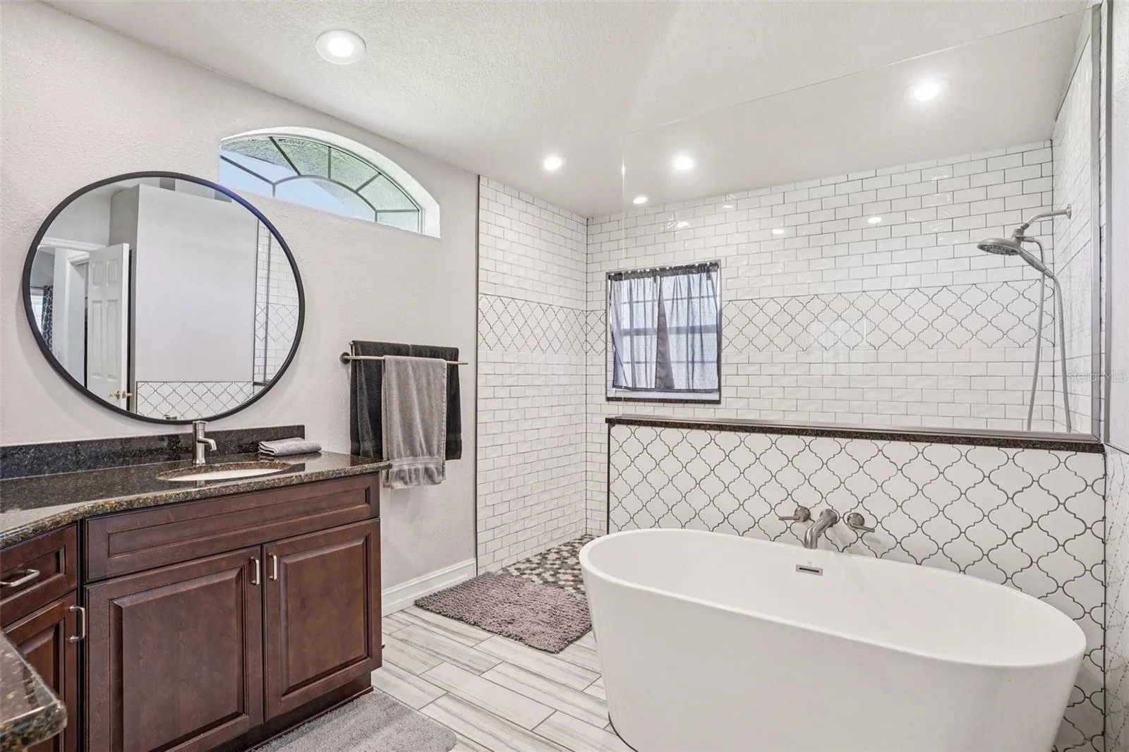 Primary Bathroom with double vanities and a stunning walk in shower and separate tub