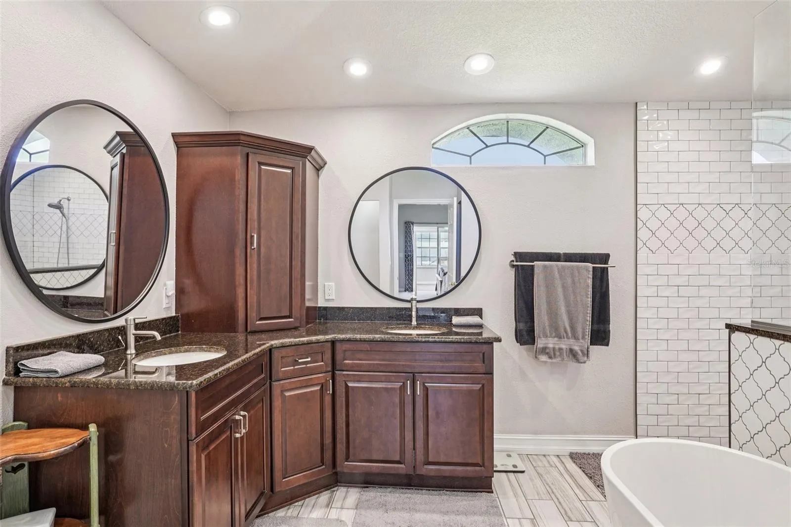 Primary Bathroom with double vanities and a stunning walk in shower and separate tub