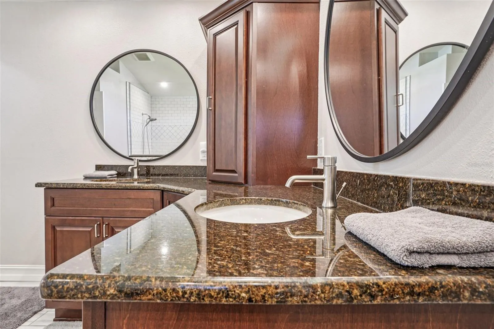 Primary Bathroom with double vanities and a stunning walk in shower and separate tub