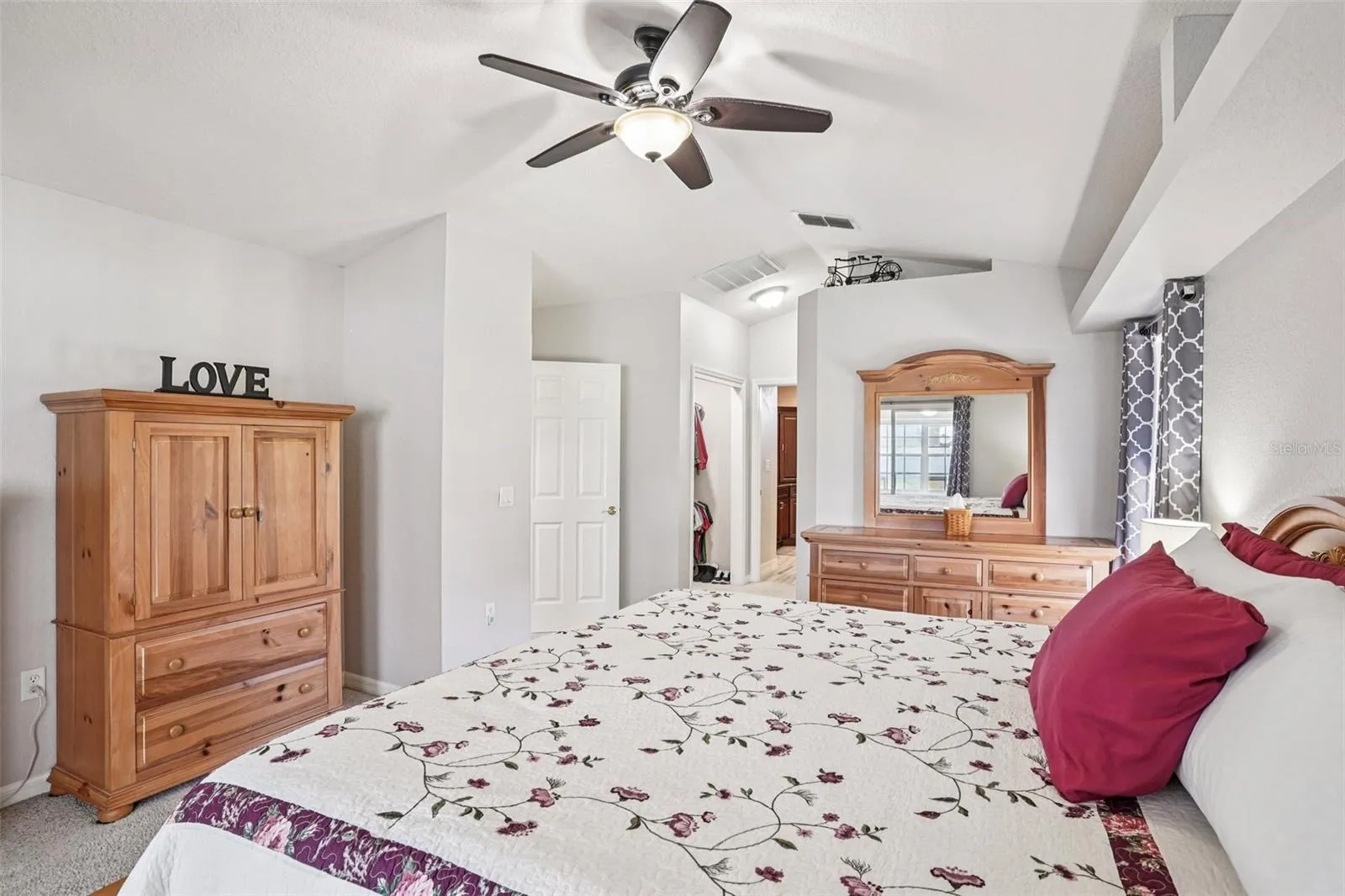 Primary Bedroom with Sliding glass doors to the Florida Room and pool.