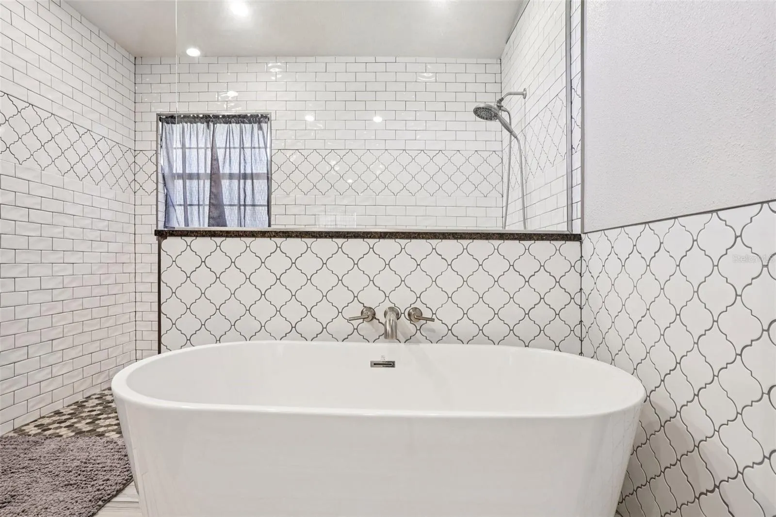 Primary Bathroom with double vanities and a stunning walk in shower and separate tub