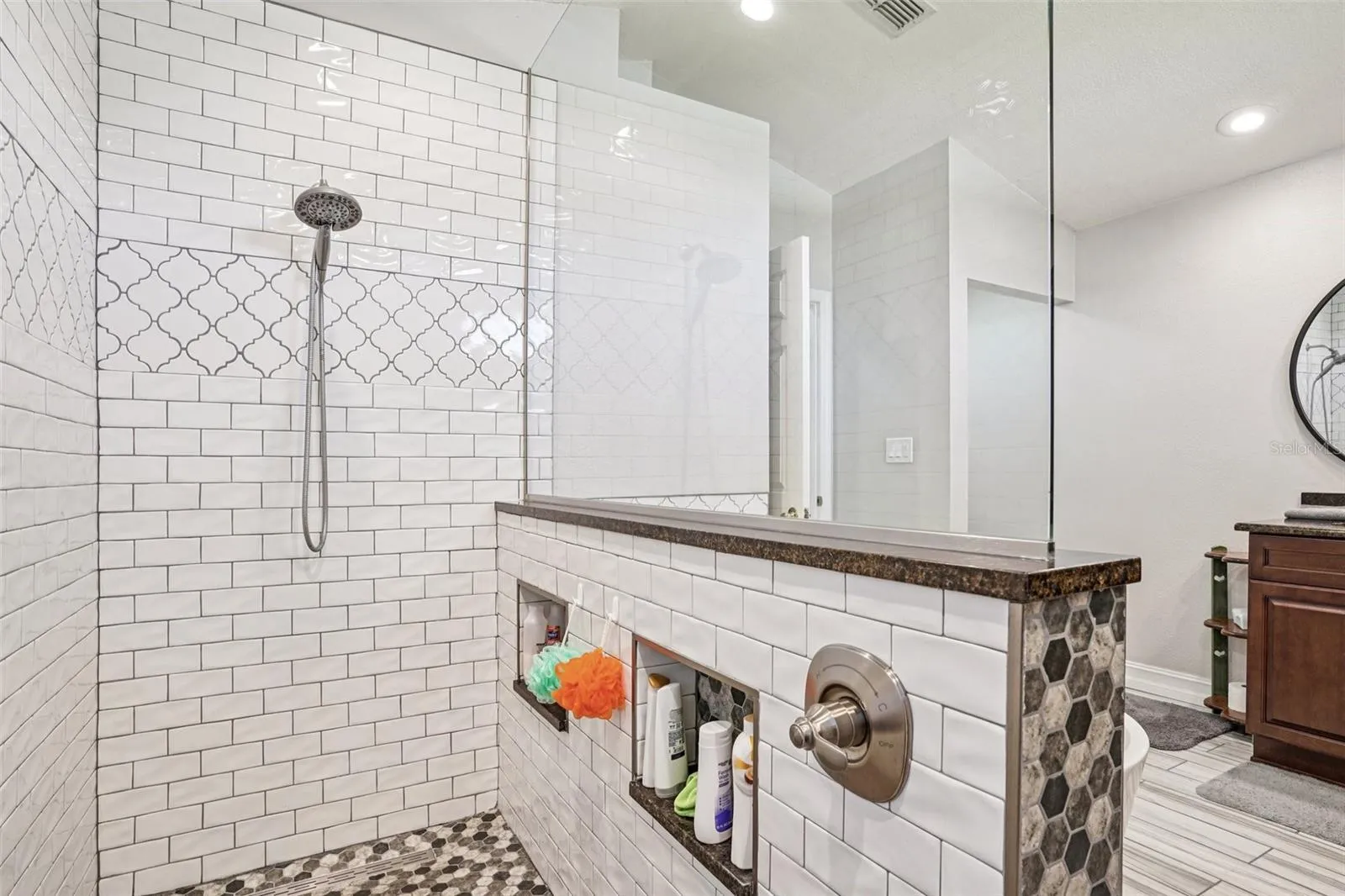 Primary Bathroom with double vanities and a stunning walk in shower and separate tub