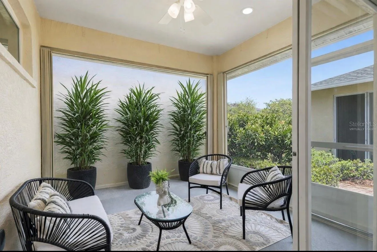 This image has been virtually staged to illustrate how strategic plant placement can enhance privacy while maintaining a light, open feel.