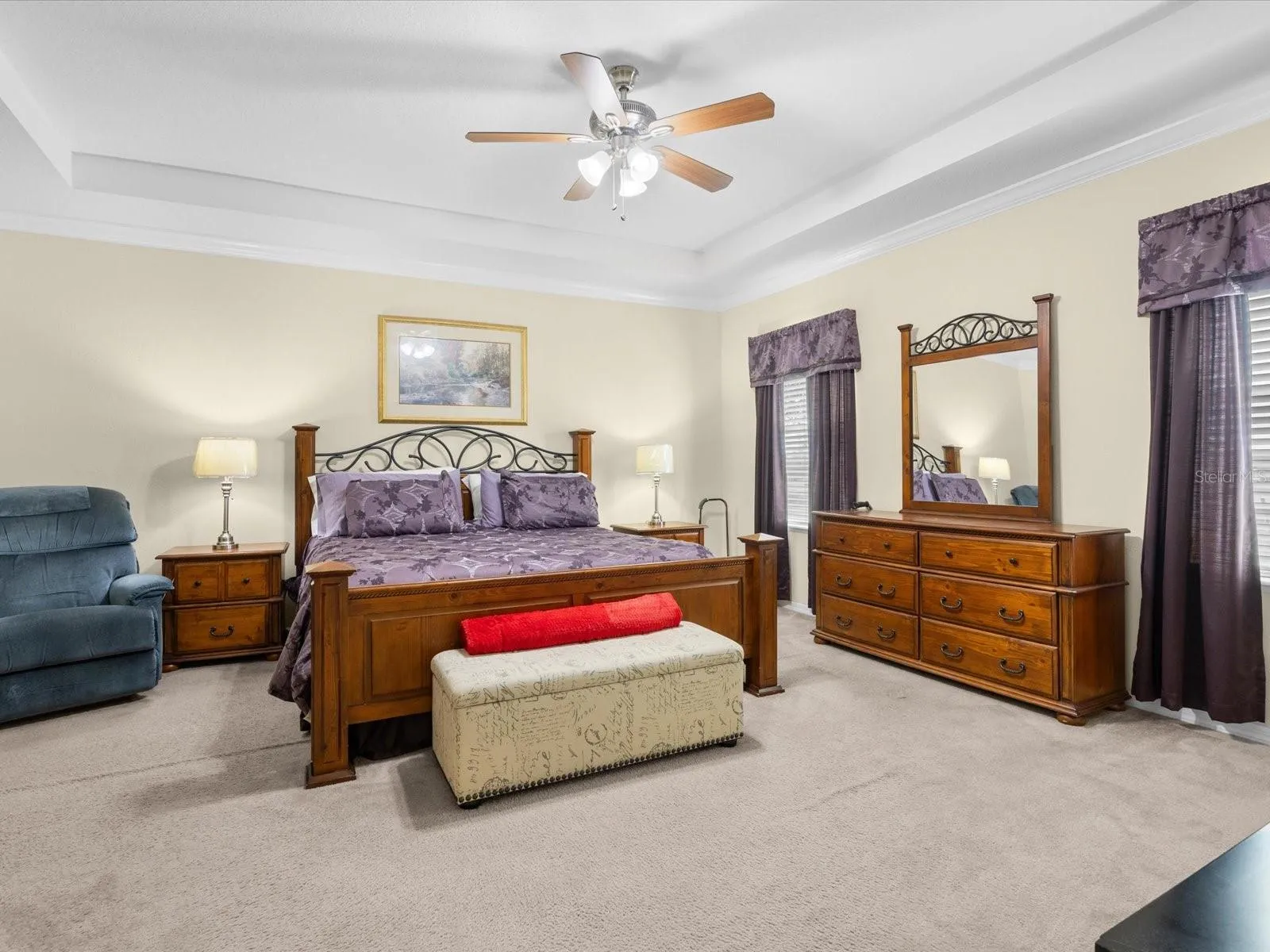 Primary bedroom with tray ceiling