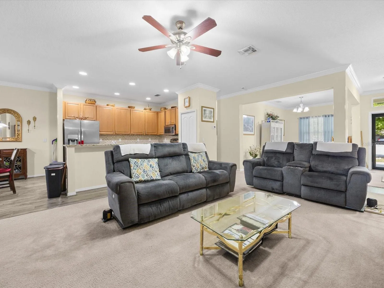 Family room with view into the kitchen and dining room