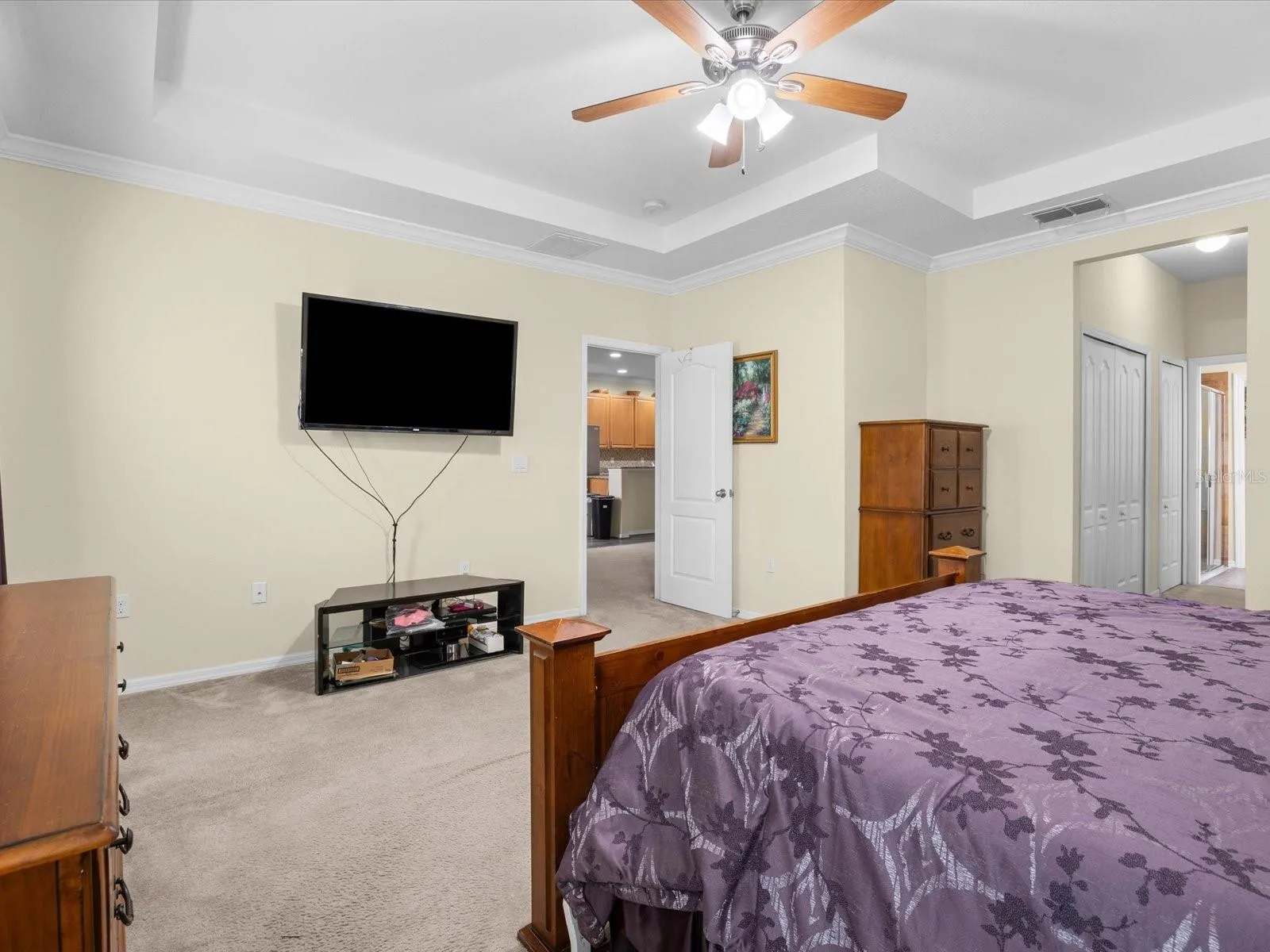 Primary bedroom with tray ceiling