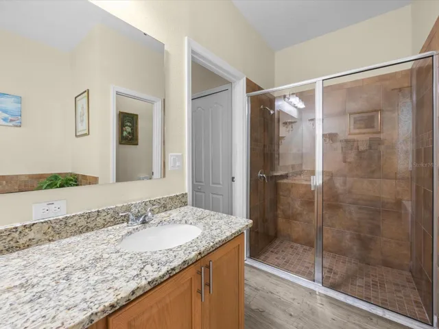 Primary bathroom with walk in shower and double sink.