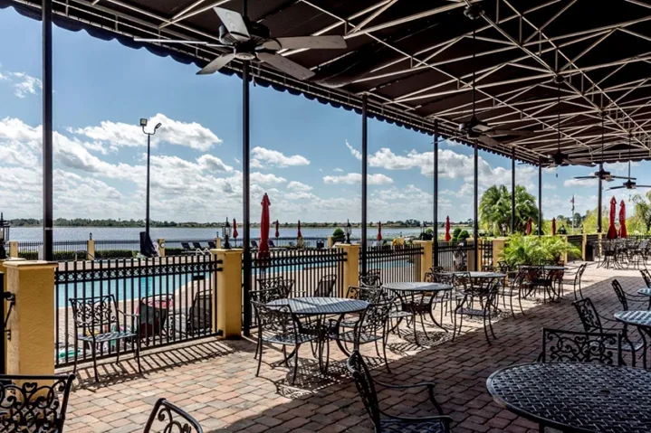 The outdoor seating area of the main clubhouse restaurant/bar has a great view of Lake Ashton.