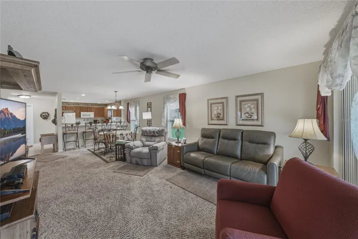 This view from the primary suite doorway shows both the openness and efficient layout of this portion of the home.