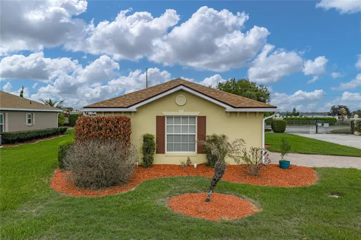 The large window is in the attached 2 car garage. The decorative shutters add to the curb appeal.