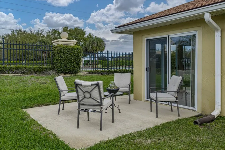 The open patio is accessible from the enclosed lanai.
