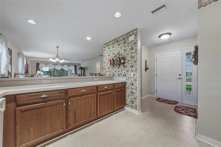 The foyer is adjacent to the kitchen.
