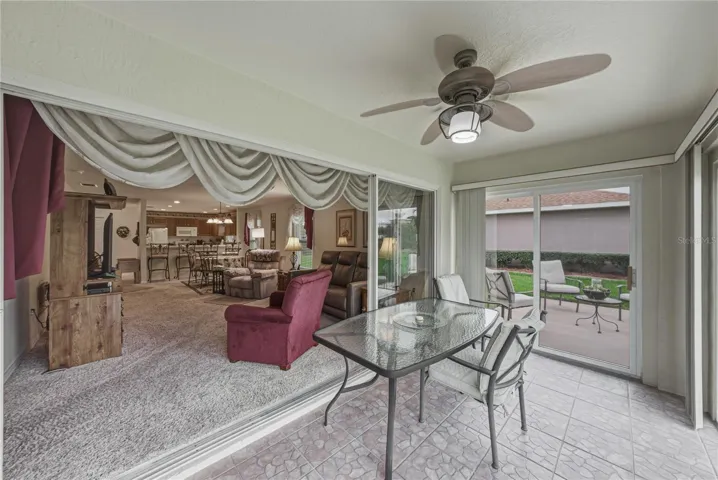 The enclosed lanai can be closed off from the rest of the home by the triple slider in the living room.