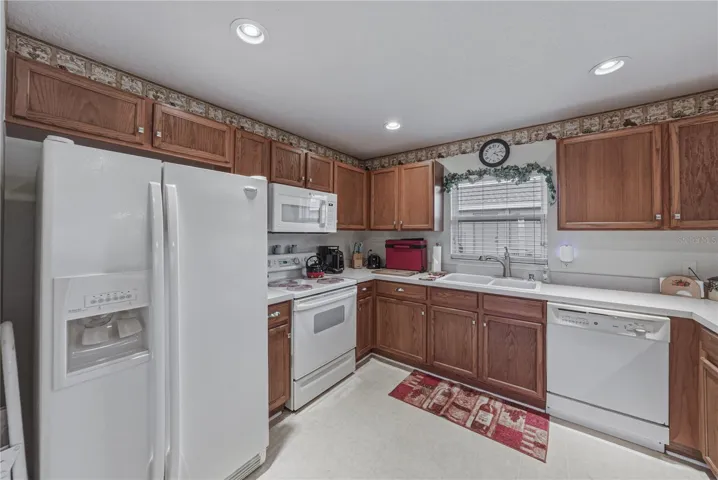 The U shaped kitchen has ample cabinetry and counter space.