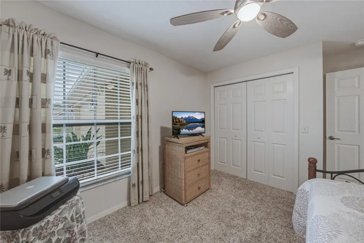 The guest bedroom is near the front of the home.