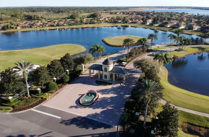 Lake Ashton has 2 par 70 private golf courses. The island green of the signature par 4 11th hole is on the left of the entry with the 12th hole on the right.