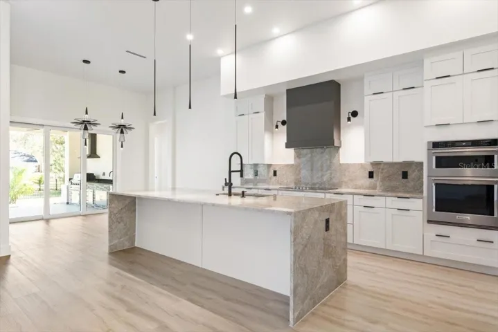 Gourmet Kitchen w/Dining and Lanai Access
