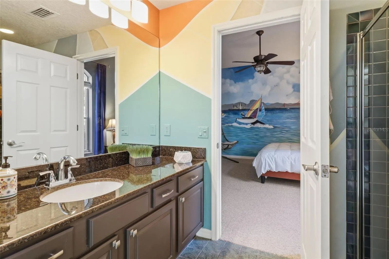 Stylish pool bath with walk-in shower—easily accessible from the bedroom and outdoor pool area