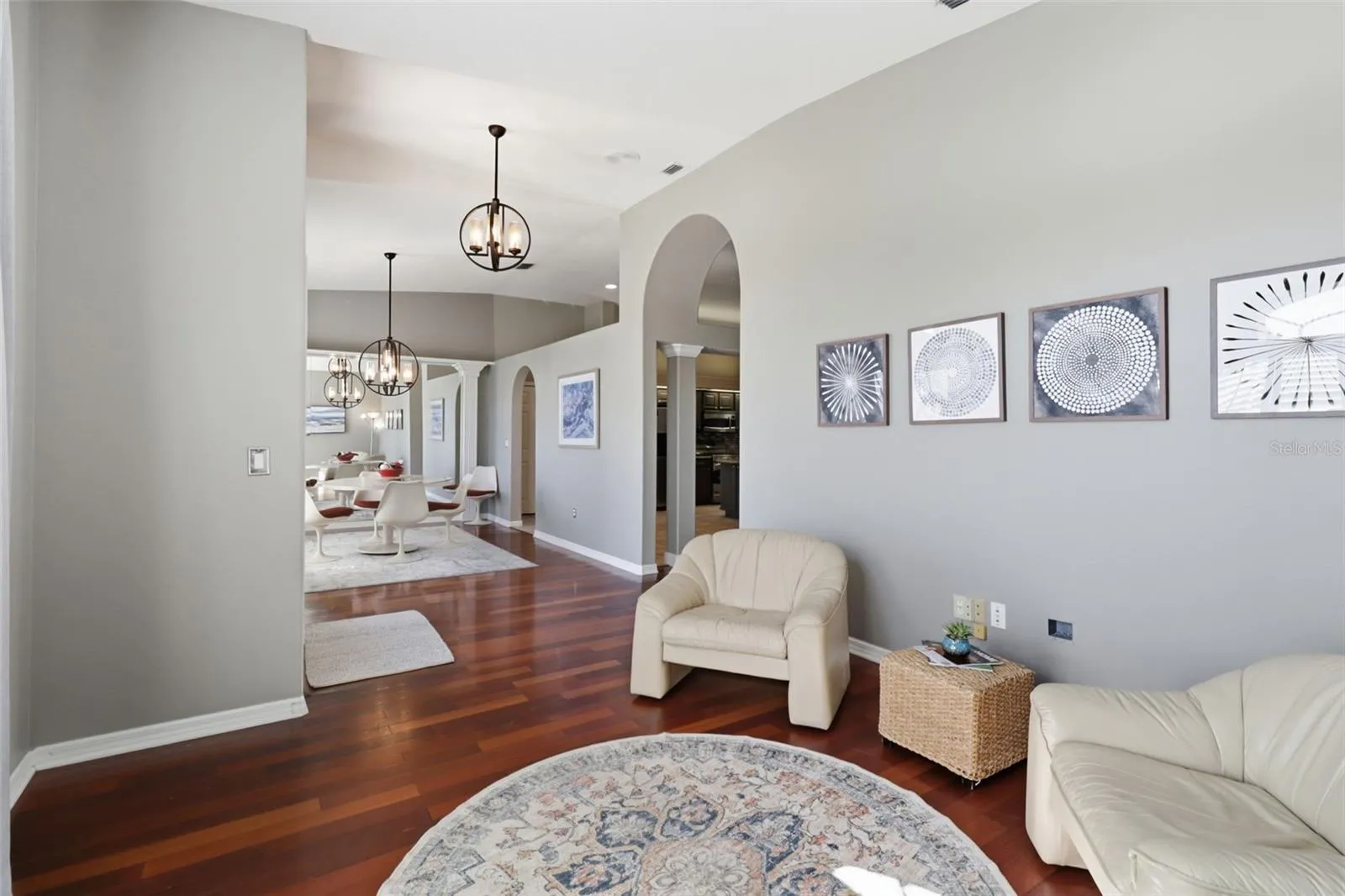 Sitting area off the entry with open flow into the formal dining room