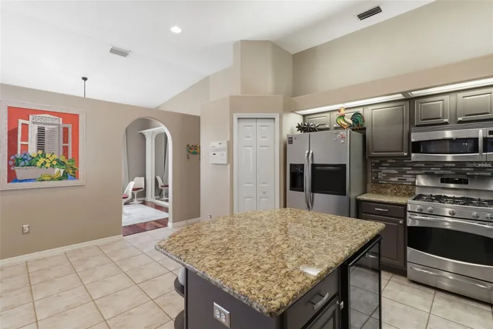 Functional kitchen layout with convenient access to the pantry, formal dining room, and garage entry