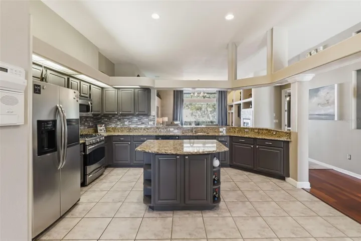right kitchen with ample counter space and a central island—perfect for everyday living