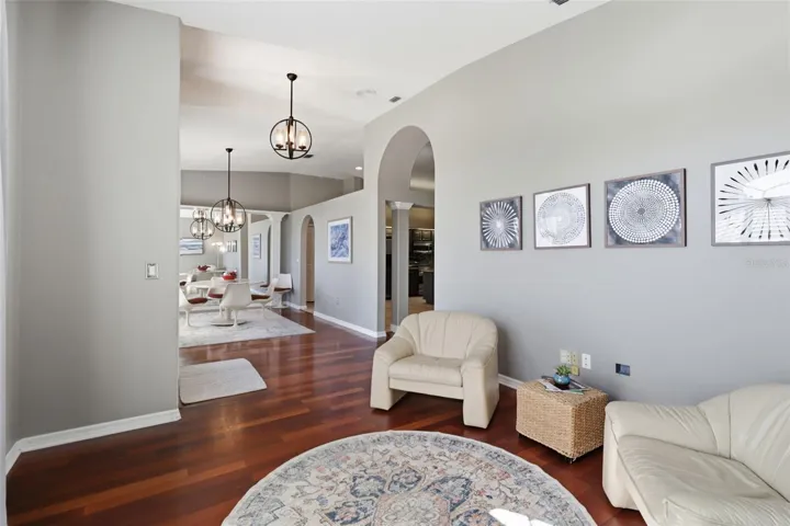 Sitting area off the entry with open flow into the formal dining room