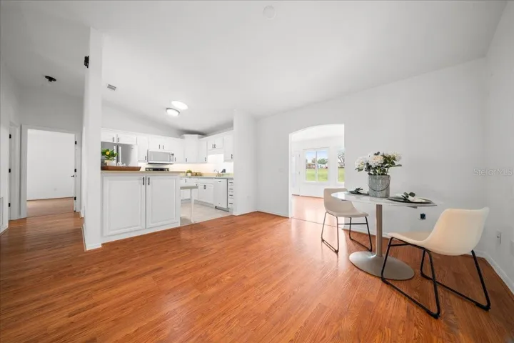 Dining Room Connects Conveniently to Kitchen and Florida Room