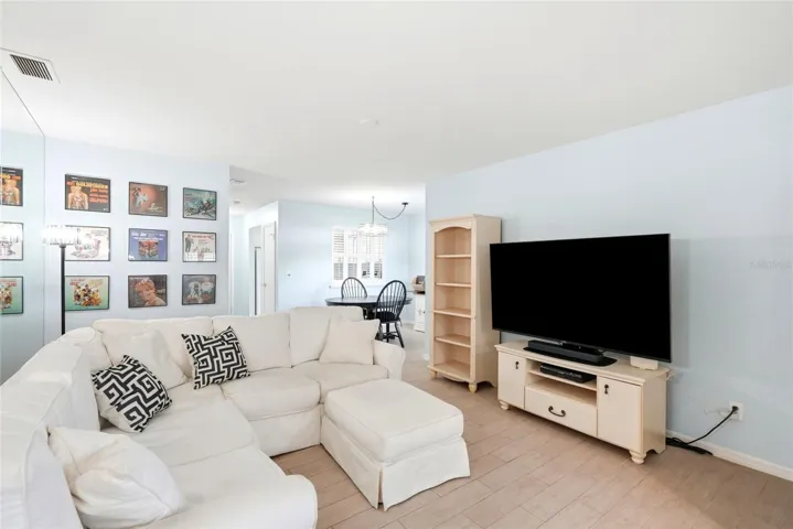 Living room with dining room in background