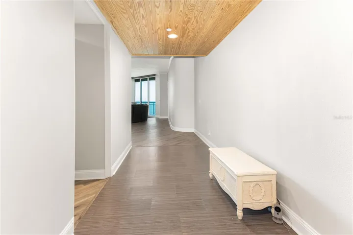 Gorgeous entryway featuring beautifully finished wood plank ceilings