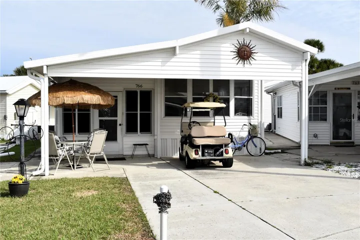 Shaded front patio and car port area