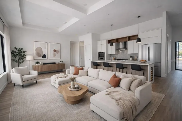 Virtually Staged. Cozy and well-lit living room featuring a functional layout that offers both comfort and practicality. The space benefits from abundant natural light, creating a warm and inviting atmosphere, perfect for relaxing with family or entertaining guests. Versatile area with easy flow to the rest of the home.