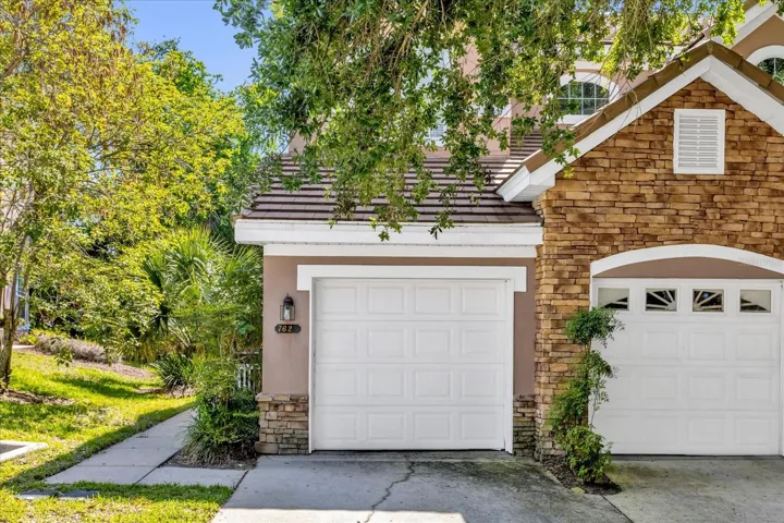 Front with 1 car garage and private driveway