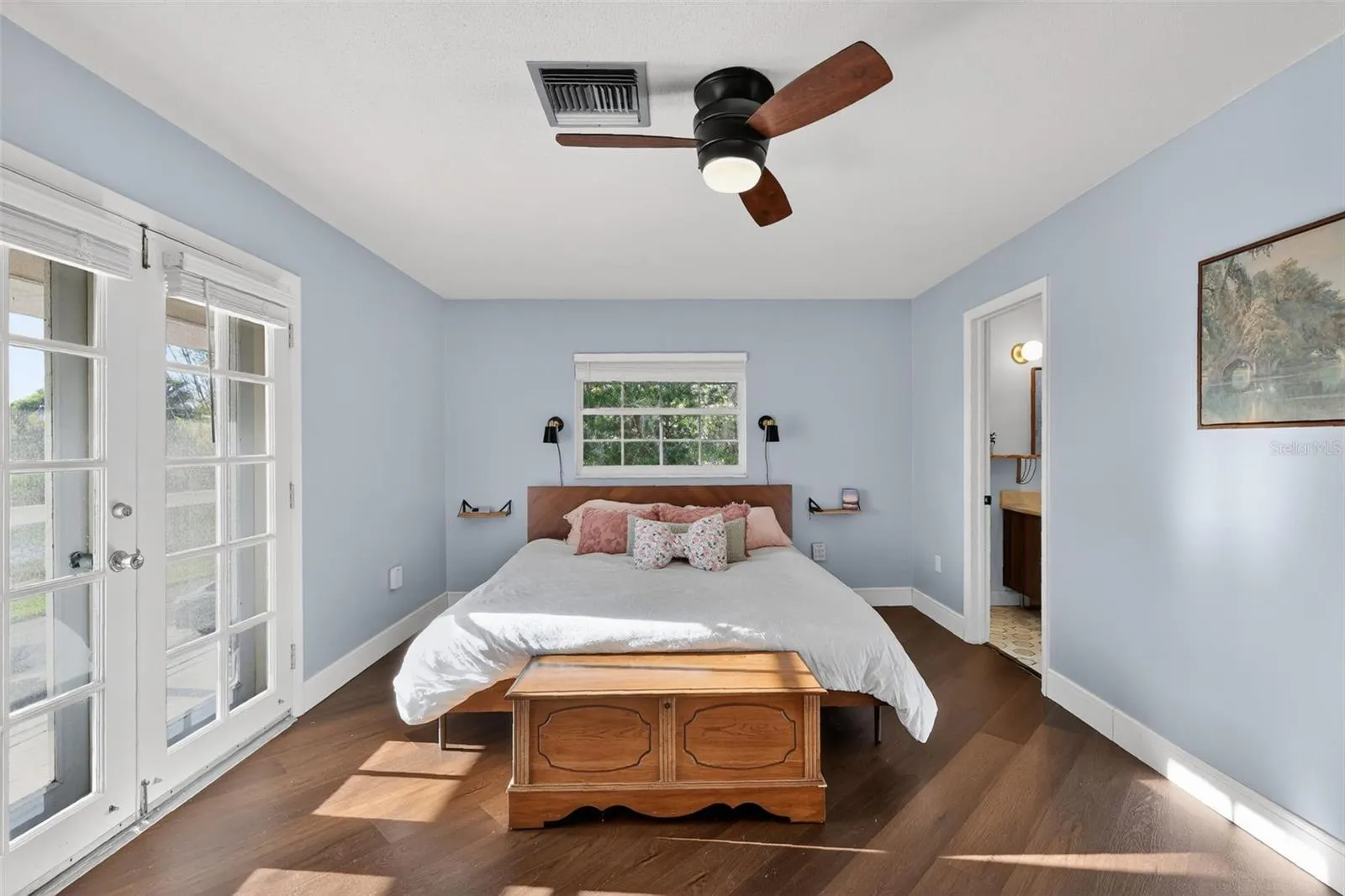 Primary Bedroom with balcony access and view of the lake