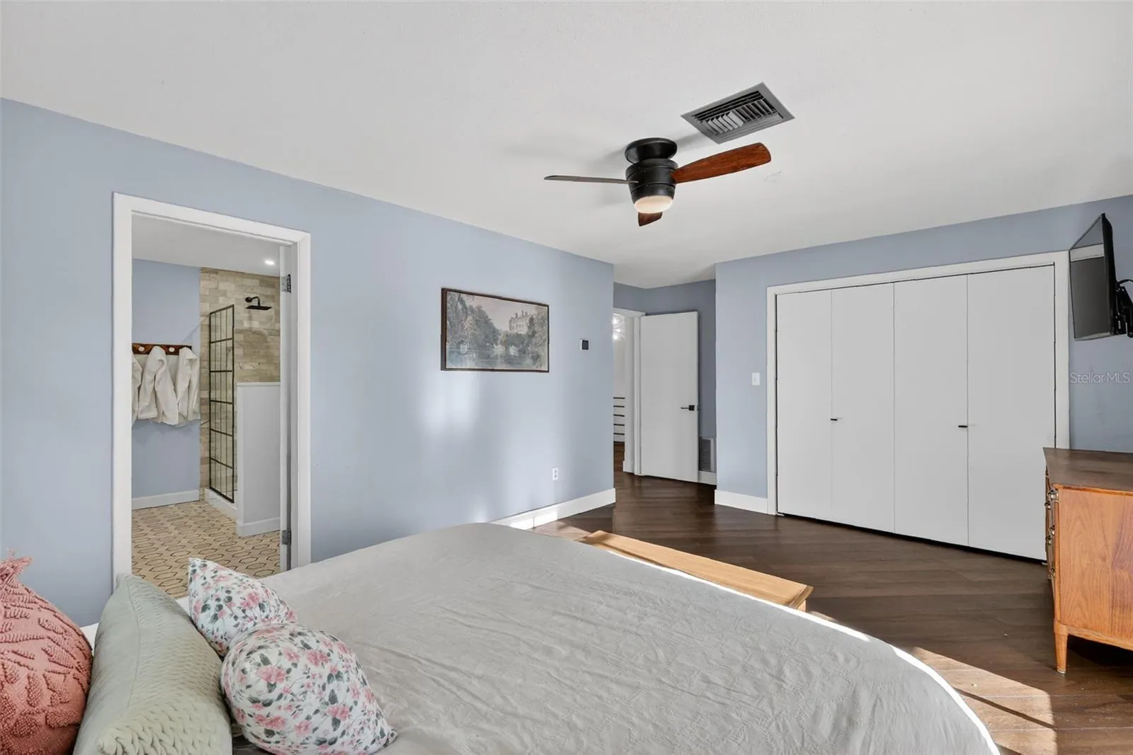 Primary Bedroom with balcony access and view of the lake