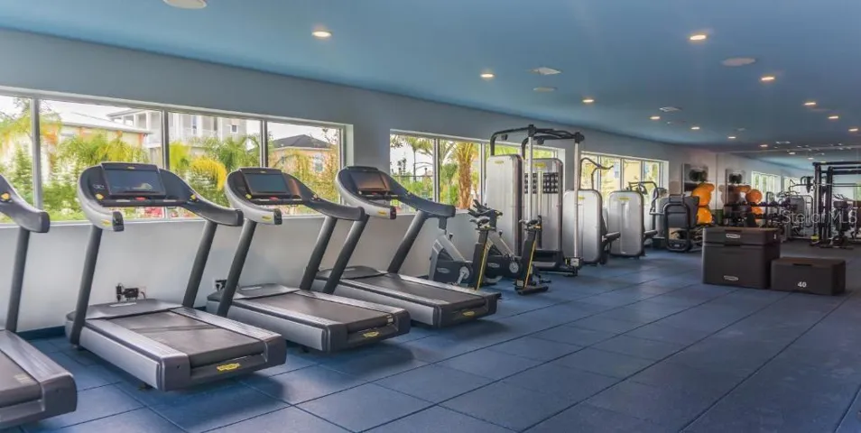 Modern fitness center with equipment in Margaritaville Resort Orlando KissimmeeModern fitness center with equipment in Margaritaville Resort Orlando Kissimmee