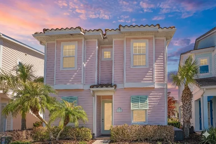 Coastal inspired Margaritaville cottage in Kissimmee Florida near Disney with vibrant exterior and prime resort location
