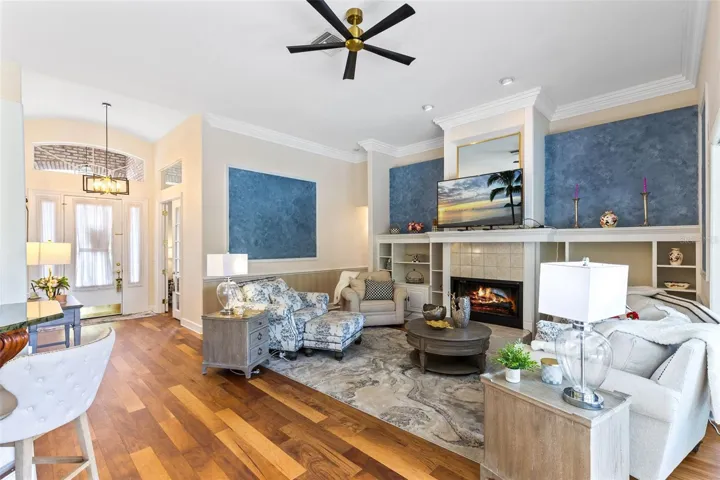 FRONT ENTRY DOOR ON THE LEFT AND LARGE FAMIY ROOM WITH FIREPLACE