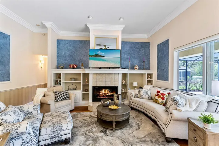 FAMILY ROOM WITH FIREPLACE AND OPEN SHELVING