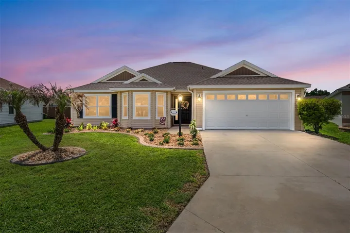 FRONT EXTERIOR @ DUSK - 5511 Head Way, VILLAGE of McCLURE. This OPEN CONCEPT, WHISPERING PINE Designer w/ 3 BR/2 BA, 2 CAR GARAGE is situated on an OVERSIZED LOT with REAR PRIVACY FENCE.