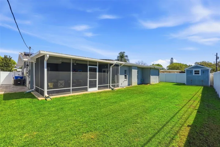 Fully fenced in backyard with pavers down the side. Plenty of space for a pool!