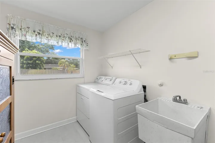 Laundry room with additional storage